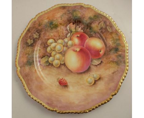 A Royal Worcester cabinet plate, decorated with fruit to a mossy background by Higgins, with shaped gilt edge, diameter 10.75