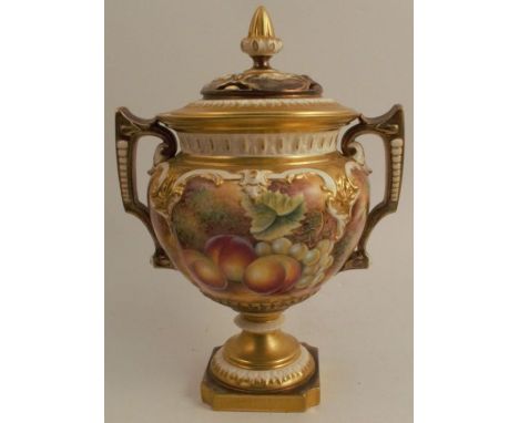 A Royal Worcester covered vase, raised on a pedestal and decorated all round with hand painted fruit by Leaman, shape number 