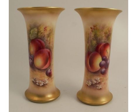 A pair of Royal Worcester spill vases, decorated half round with hand painted fruit by Townsend, height 7.5ins - both in good