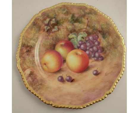 A Royal Worcester cabinet plate, decorated with fruit to a mossy background by Freeman, with shaped gilt edge, diameter 10.75