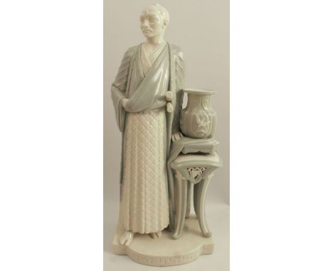 A Royal Worcester figure, of a Chinese man standing next to an urn on a plant stand, decorated in green and white, height 17i