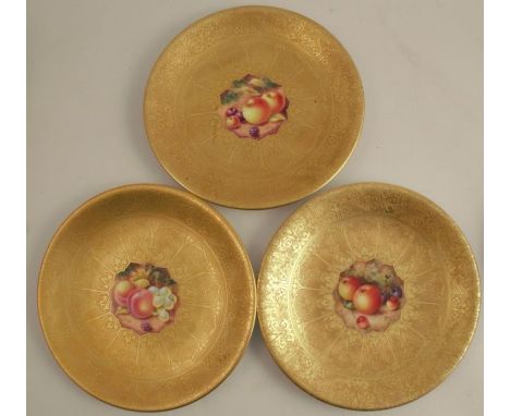 Three Royal Worcester plates, decorated with a central panels of fruit by Freeman and Henry (2), to an etched acid gilt groun