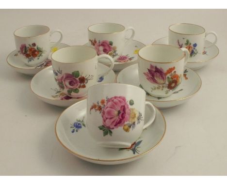 A set of six Meissen porcelain cups and saucers, decorated with flowers, crossed swords mark to base