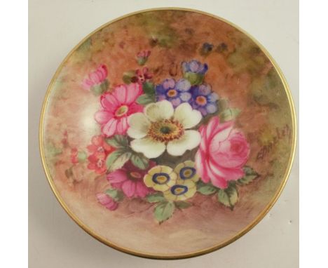 A Royal Worcester circular dish, decorated with flowers by E Barker, diameter 2.75ins - very crazed
