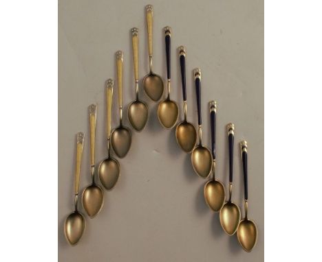 A set of six silver gilt and enamel coffee spoons, decorated in yellow and white, together with another similar set in blue a