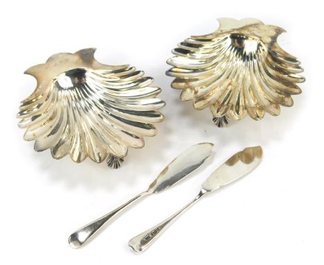 A pair of Edward VII butter dishes, of shell form, each raised on three shell cast feet, initialled engraved K P &amp; J F P,