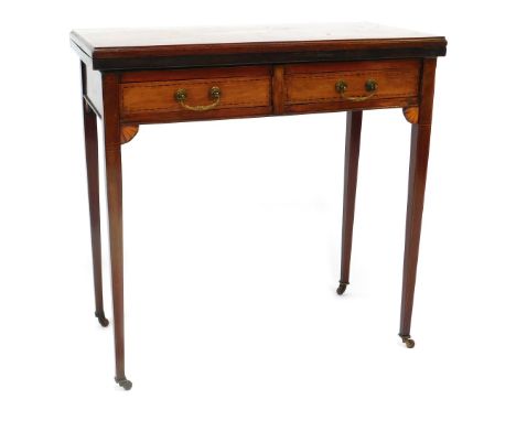 An Edwardian mahogany tea table, with marquetry central oval panel, folding top, above arrangement of two drawers on taper le