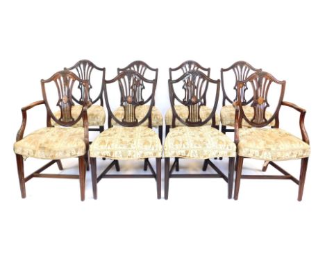 A set of eight late 19th/early 20thC mahogany dining chairs, the shield shaped back carved with wheat ears, inlaid with overa