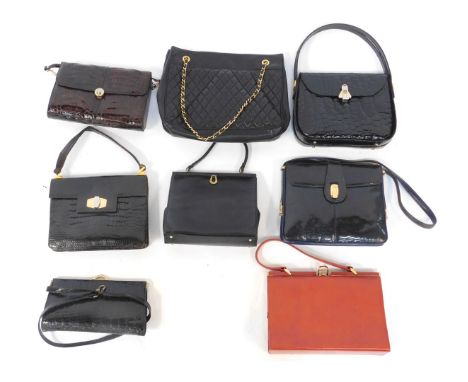A group of early 20thC and later handbags, to include a simulated black lizard skin top handle bag, mid century simulated cro
