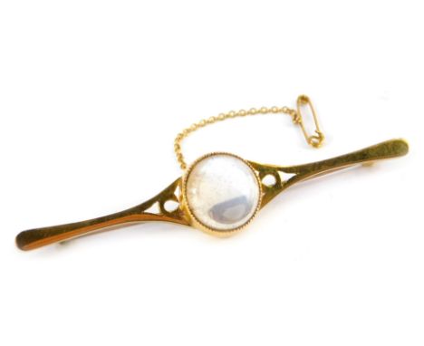A moonstone bar brooch, the circular moonstone in a rub over setting, with pierced design shoulders, on petallated band, yell