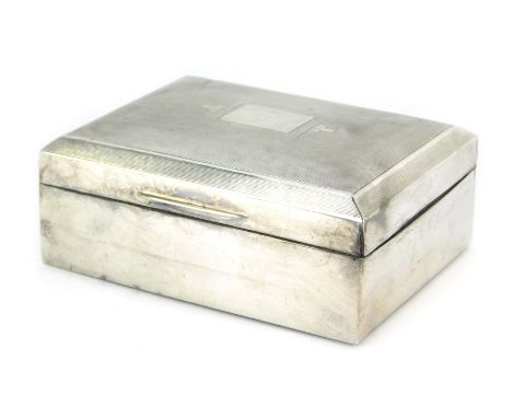 A George VI silver cigarette box, of rectangular form, the hinged lid with engine turned decoration, enclosing a treen lined 