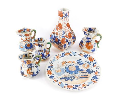 A group of Masons and other ironstone, to include four jugs, 10cm and 9cm high, a square vase of tapering form, 20cm high, an