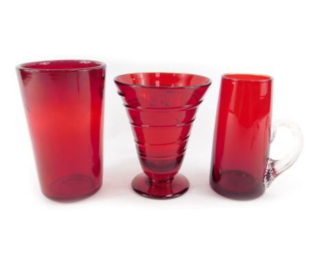 A Whitefriars studio glass ruby red vase, designed by Barnaby Powell, of conical design with raised trailing decoration, on o