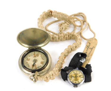 A stainless steel cased pocket compass, and a chrome cased wristwatch, on black leather strap. (2) 