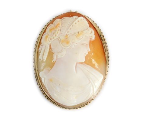 A 19thC shell cameo brooch, depicting maiden facing dexter, in a rub over setting with rope twist border, on single pin back 