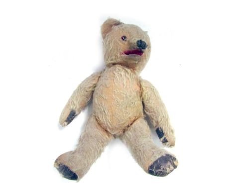 A 1950s mohair Teddy Bear, with felt pads and opposable arms and legs, 30cm high.