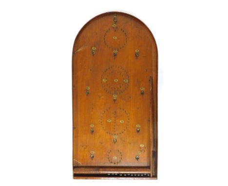 An early 20thC oak bagatelle board, 77cm high.