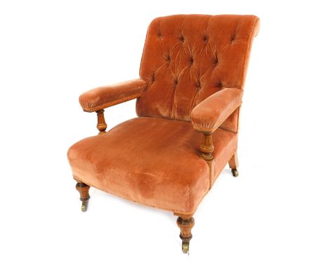 A Victorian elm open chair, with scroll back and button back detail, turned legs, terminating casters, 90cm high, 62cm wide, 