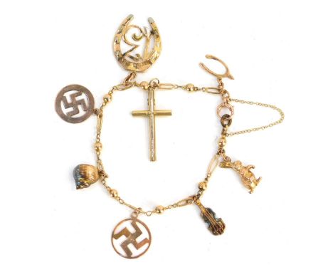 A charm bracelet, with spherical bead and oblong bar bracelet, set with numerous charms, to include 13, shell, cello, wishbon