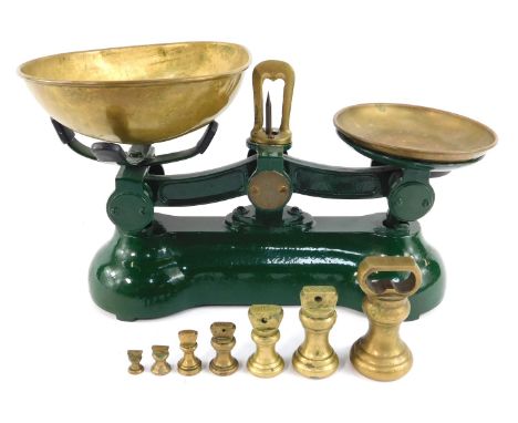A set of green cast metal and brass scales, 20cm high, with various brass weights.