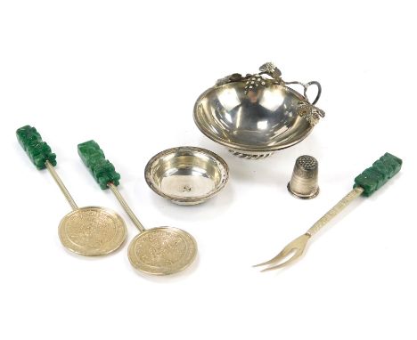 A group of white metal, to include a wine tasting cup, of circular tapering form, decorated with a vine leaf and grape handle