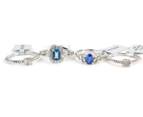 Four Gems TV dress rings, each stone set, two with light blue stones, the other with CZ and imitation diamonds, white metal s