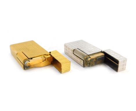 Two Flaminare pocket lighters, comprising a ribbed brass cased example, 6cm high, and a steel finish cross hatched lighter, 5