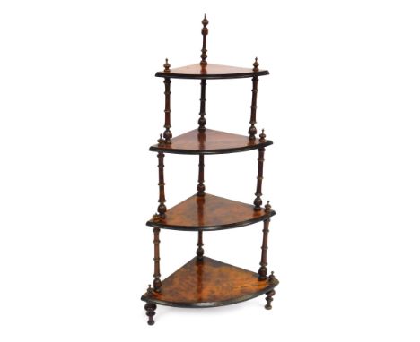 A Victorian figured walnut corner whatnot, of three tiers, with bobbin turned supports, 115cm high, 64cm wide, 40cm deep. 