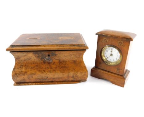 An early 20thC oak and inlaid mantel clock, the circular enamel dial bearing Arabic numerals, 14cm high, together with a Geor