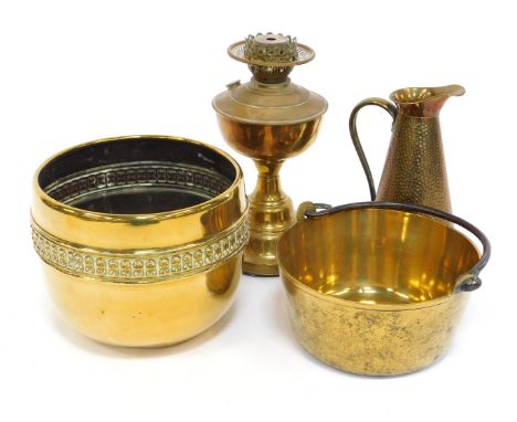 A group of brass ware, to include oil lamp base, 33cm high, circular planter, 25cm diameter, brass jam pan, etc. (a quantity)