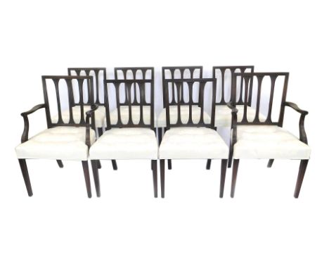 A set of eight 19thC mahogany dining chairs, each with a carved rail back, a button padded seat upholstered in cream damask, 