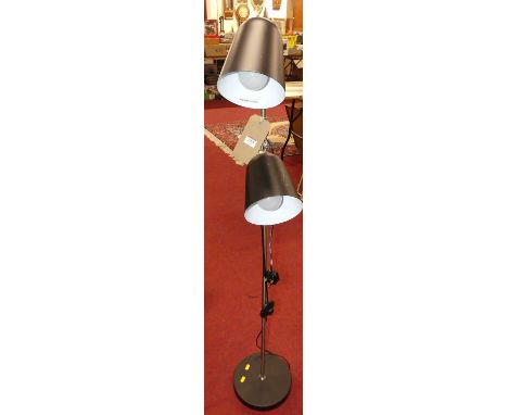 A contemporary brushed aluminium and anodised metal twin branch floor light 