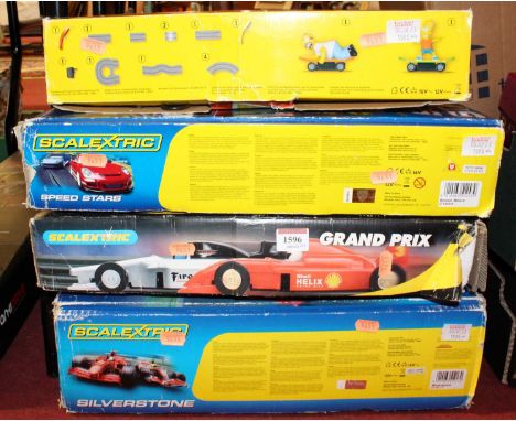 Four boxed modern release Scalextric gift sets to include Silverstone and The Simpsons