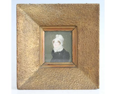 19th century English school - half-length portrait of middle-aged woman wearing a lace bonnet, miniature watercolour on ivory