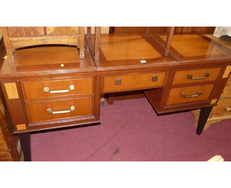 A contemporary cherrywood kneehole long dressing table, having a hinged central compartment with interior bevelled mirror, fo