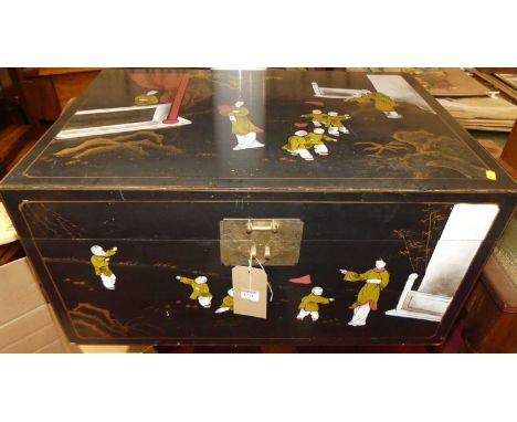 A contemporary black lacquered and gilt decorated Oriental hinge top trunk, with brass end carry handles and lock, width 76cm