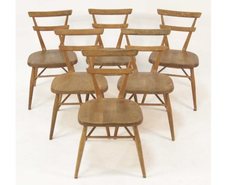 A set of six 1960s Ercol blond elm children's stacking chairs, each having twin curved bar backs and slightly dished seats to