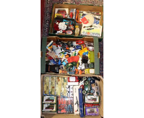 Three trays containing a collection of mixed modern issue boxed and loose diecast vehicles, action figures, and spare parts t