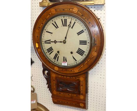 A Victorian walnut and inlaid circular drop trunk wall clock, with pendulum, height 70cmNot currently working.Missing trim is