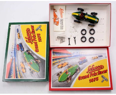 Schuco No.1075 Grand Prix Racer Set, comprising green tinplate car with tools and replacement wheels, together with leaflet a