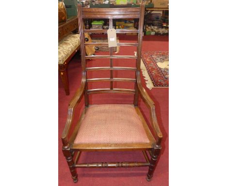 An Arts &amp; Crafts walnut reeded ladderback elbow chair, having upholstered cushion seat, w.54cmSturdy.With light signs of 