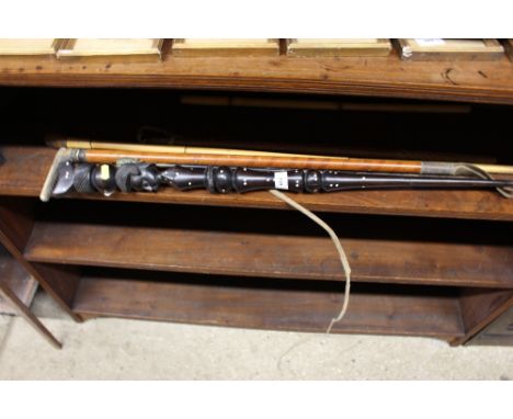 An Ethnic hardwood walking stick; and various other walking sticks and crops