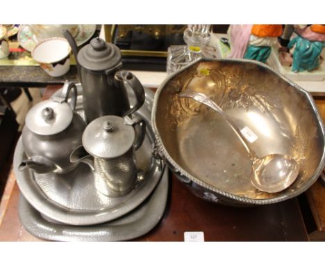 A plated punch bowl and ladle; a spot hammered pewter items; glass decanter etc.