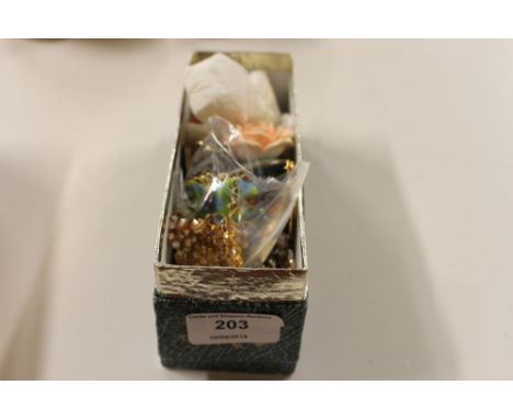 A box containing various enamel decorated and other pendants etc. 
