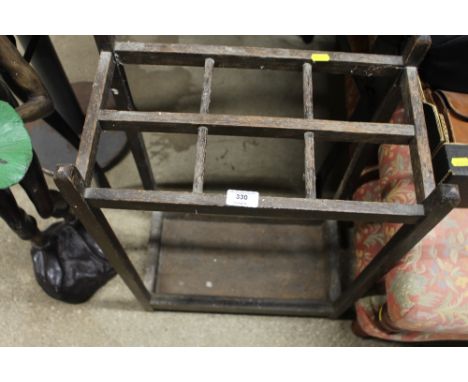 An oak six division stick stand