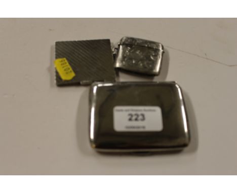 A silver cigarette case, silver vesta case, and a silver compact