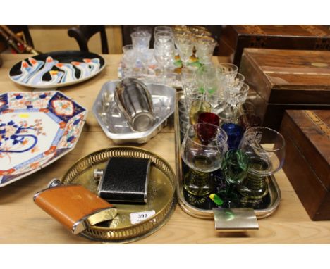 A quantity of various table glassware; drinks trays; cocktail shaker; hip flask etc.