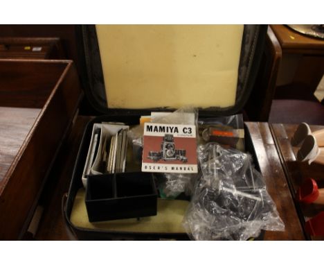 A Mamiya camera and case 