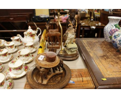 Various carved wood ornaments; an owl table lamp; a cribbage board etc.