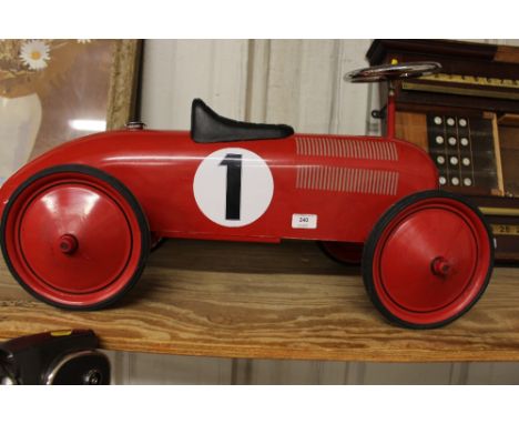 A child's vintage style motor racing car 
